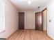 Bedroom features a neutral paint, hardwood floors, a ceiling fan and a view of a closet at 5365 Renault St, Cumming, GA 30041