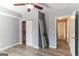 Bedroom features modern grey walls, a ceiling fan, and a closet with a white sliding door at 5365 Renault St, Cumming, GA 30041