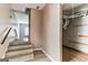 Hallway with a staircase and wood-look floors, and a partial view of some exposed ductwork at 5365 Renault St, Cumming, GA 30041