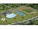 Aerial view of community amenities including a pool, tennis courts, playground, and well-maintained landscaping at 588 Parnassus Road, Locust Grove, GA 30248