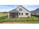 Fenced backyard with patio sitting area ensures private, outdoor relaxation and entertaining at 588 Parnassus Road, Locust Grove, GA 30248
