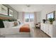 Comfortable bedroom with a well-appointed bed, ample natural light, and stylish decor at 588 Parnassus Road, Locust Grove, GA 30248