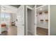 Bedroom featuring walk-in closets, offering generous storage space and leading to a well-lit bedroom area at 588 Parnassus Road, Locust Grove, GA 30248