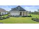 Charming single-Gathering home with a well-manicured lawn, attached garage, and stone and siding exterior at 588 Parnassus Road, Locust Grove, GA 30248