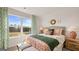 Bedroom with a bed with decorative pillows and a dresser next to a window at 588 Parnassus Road, Locust Grove, GA 30248