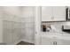 Walk-in pantry with ample shelving space, complementing the kitchen's modern cabinets and countertops at 588 Parnassus Road, Locust Grove, GA 30248