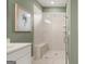 A glass shower with a bench and a rain shower head ensures a relaxing and luxurious experience at 588 Parnassus Road, Locust Grove, GA 30248