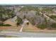 Aerial view of home showcasing mature trees and long driveway at 4601 Highway 81 E, Mcdonough, GA 30252