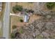 Birds eye view of the residence showing the roof, long drive, and surrounding landscape at 4601 Highway 81 E, Mcdonough, GA 30252