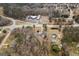 Wide angle aerial shot showing property and surrounding buildings and landscape at 4601 Highway 81 E, Mcdonough, GA 30252