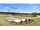 Well-maintained bocce ball courts, framed by lush landscaping, for outdoor community recreation at 600 Parnassus Rd, Locust Grove, GA 30248