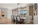 Bright dining room with a modern light fixture and neutral color palette at 600 Parnassus Rd, Locust Grove, GA 30248