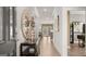 Inviting foyer with hardwood floors, stylish console table, and decorative mirror at 600 Parnassus Rd, Locust Grove, GA 30248