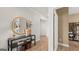 Bright foyer featuring hardwood floors, a stylish console table, and a decorative mirror at 600 Parnassus Rd, Locust Grove, GA 30248