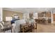 Open concept living room with modern decor, adjacent to the kitchen with bar stool seating at the island at 600 Parnassus Rd, Locust Grove, GA 30248