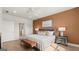 Main bedroom featuring a window with natural light and a bench at 600 Parnassus Rd, Locust Grove, GA 30248