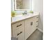 Bathroom vanity with white countertop, matte black hardware, and a stylish lighted mirror at 2594 Cavalier Dr, Decatur, GA 30034