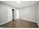 Bedroom with hardwood flooring, neutral paint, and a spacious closet at 2594 Cavalier Dr, Decatur, GA 30034