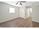 A bright bedroom with a window, closet, vinyl flooring, and a ceiling fan at 2594 Cavalier Dr, Decatur, GA 30034