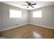 Cozy bedroom with hardwood flooring and bright natural light from the windows at 2594 Cavalier Dr, Decatur, GA 30034