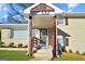 Inviting front porch with craftsman details and a well-maintained landscaped lawn at 2594 Cavalier Dr, Decatur, GA 30034