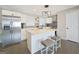 Bright kitchen featuring stainless steel appliances, a central island, and sleek white cabinetry at 2594 Cavalier Dr, Decatur, GA 30034