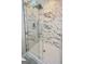 Glass shower featuring sleek hardware and elegant marble-look tile surround at 2594 Cavalier Dr, Decatur, GA 30034