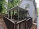 Backyard view of deck with railings, a covered patio area, and outdoor furniture for relaxation and entertainment at 1103 Coleman Sw St, Atlanta, GA 30310