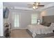 Bright and airy bedroom with trey ceilings, a ceiling fan, and a door to the exterior at 1103 Coleman Sw St, Atlanta, GA 30310