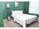 Bedroom with green walls, a large window, and a full-sized bed with white comforter and pillows at 1103 Coleman Sw St, Atlanta, GA 30310
