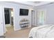 Primary bedroom featuring a television, an ensuite bathroom, and access to an outdoor patio at 1103 Coleman Sw St, Atlanta, GA 30310