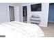 Comfortable bedroom with a television and a round shelf for decorative items and personal belongings at 1103 Coleman Sw St, Atlanta, GA 30310