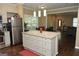 Eat-in kitchen features stainless steel appliances, granite countertops, and view into the dining area at 1103 Coleman Sw St, Atlanta, GA 30310