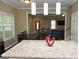 Kitchen island overlooking dining area with an open view to the living room at 1103 Coleman Sw St, Atlanta, GA 30310