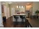 Eat-in kitchen with island, stainless steel appliances, and view into the dining area at 1103 Coleman Sw St, Atlanta, GA 30310