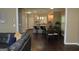Open-concept kitchen features a large island, modern pendant lighting, and stainless steel appliances at 1103 Coleman Sw St, Atlanta, GA 30310