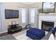 Inviting living room with a fireplace, neutral paint and a view of the front yard at 1103 Coleman Sw St, Atlanta, GA 30310