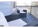 Relaxing patio area with wicker chairs, soft white cushions, and a small table, ideal for outdoor enjoyment at 1103 Coleman Sw St, Atlanta, GA 30310