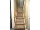 Carpeted staircase leading to the upper level of the home at 1103 Coleman Sw St, Atlanta, GA 30310