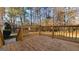 Image showcasing the wooden deck with railings, providing a cozy outdoor space at 2150 Lisbon Ln, Jonesboro, GA 30236