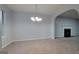 Well-lit dining area with a modern chandelier, open to other living spaces at 3355 Brookside Ln, Jonesboro, GA 30236