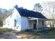 Charming home exterior featuring a covered porch and ample natural light at 735 Oglesby Bridge Se Rd, Conyers, GA 30094