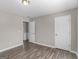 Bedroom with wood-look flooring and a door at 195 Brighton Dr, Covington, GA 30016