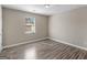 Bedroom with a window and wood-look flooring at 195 Brighton Dr, Covington, GA 30016