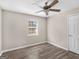 Bedroom with a ceiling fan, wood-look flooring, and window at 195 Brighton Dr, Covington, GA 30016