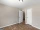 Bedroom with neutral paint, a ceiling light, and a view into another room at 195 Brighton Dr, Covington, GA 30016