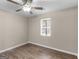 Bedroom featuring neutral walls, hardwood floors, and a ceiling fan at 195 Brighton Dr, Covington, GA 30016