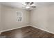 Bedroom featuring neutral walls, hardwood floors, and ceiling fan at 195 Brighton Dr, Covington, GA 30016