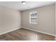 Bedroom with a window and wood-look flooring at 195 Brighton Dr, Covington, GA 30016