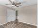 Bedroom with a ceiling fan, wood-look flooring, and closet at 195 Brighton Dr, Covington, GA 30016